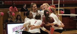 The Eagles celebrate after scoring in the first set.