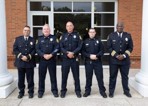 (Left to right): Lieutenant Rick Biller, Officer Thomas Holsinger, Officer John Painter, Officer Justin Shipley and Milton S. Franklin, Jr. Chief of Police. The Campus Police Officers are collaborating with local agencies to determine emergency management procedures during the pandemic.