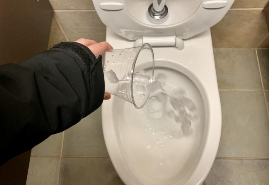 Pouring ice into the toilet