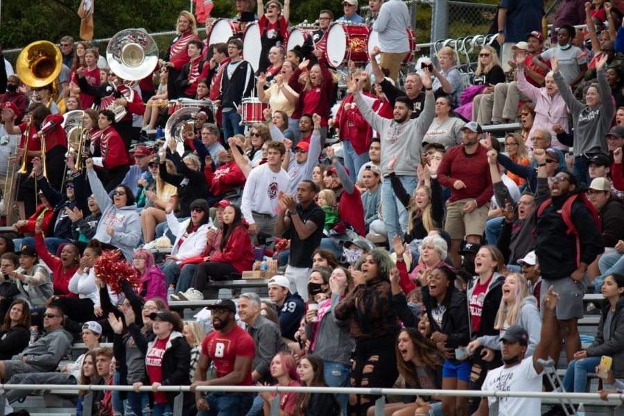 Fans cheering for BC Eagles at Homecoming football game