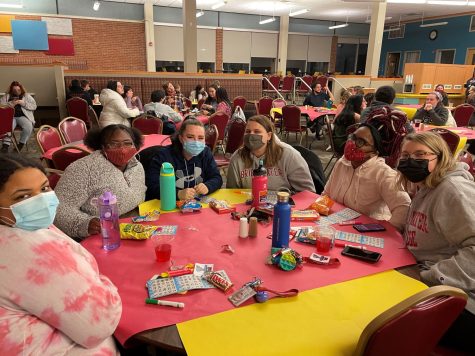 Pictured here is junior Ambria Brennan and sophomores Karris Dryden, Jasmine Jones, Kerissa Brandon, Casey Casarez and Sydni Maul at a table ready to play Bingo.