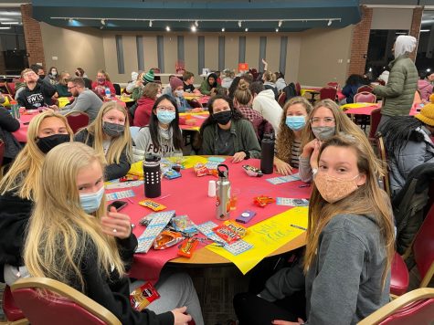 First-years Ashley Dodd, Kinley Woodard, Emily Poole and Mandy Lo; sophomores Lizzie Mumbert, Karis David and Ryan Roeber; and senior Samantha Hince wait for the bingo games to begin.