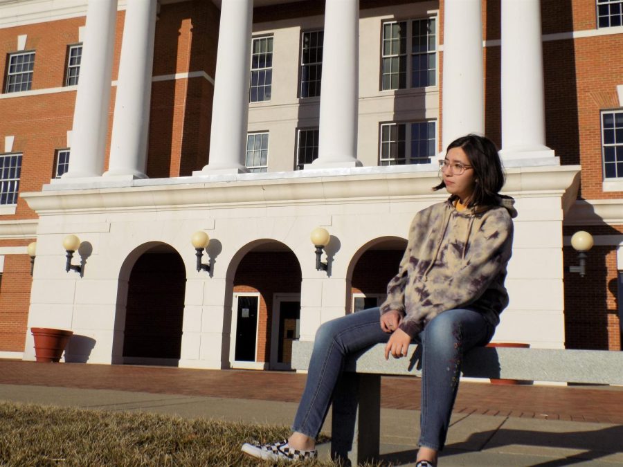 First-year Valerie Lutz sitting outside of McKinney Hall at Bridgewater College.