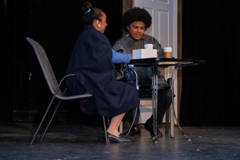 Kai Bowman as Derek speaking with Elysia Gomez as Mrs. Oliver in the second act.
