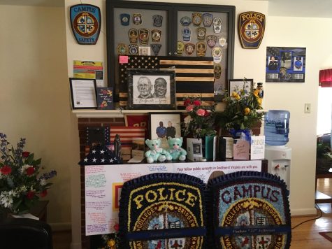 A memorial display for Officer John Painter and Officer J.J. Jefferson in the Campus Police and Safety lobby.