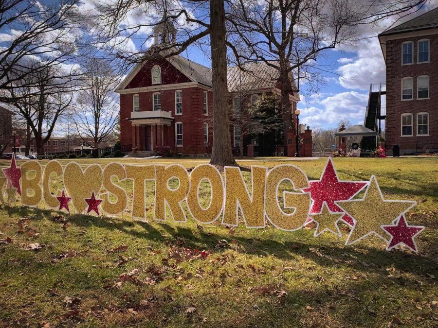 BC Strong sign outside of Memorial Hall and the memorial site of John Painter and J.J. Jefferson.