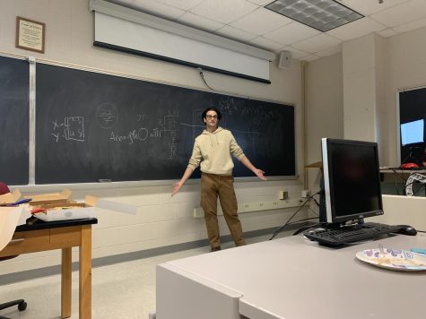 Junior Anton Kopti showing his work on the chalkboard
