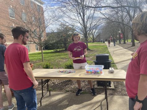 junior Seth Spire handing out Easter eggs