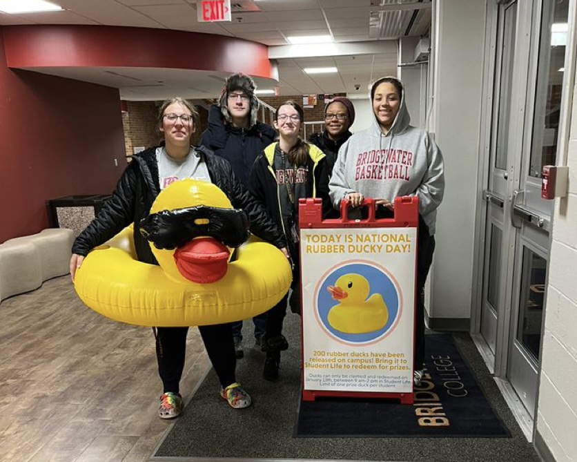 The CEAT team, junior Mae Lotts, sophomores Sam Kreiger and Erica Tiffany, senior Janae Ackerman and junior Sloan Morton, early morning as they prepare to split the campus into sections to hide the ducks. After the group finished their jobs, they met back up and ate breakfast as per tradition. 