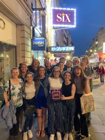 The students on the Oxford trip stand outside the theater presenting “SIX the Musical.”