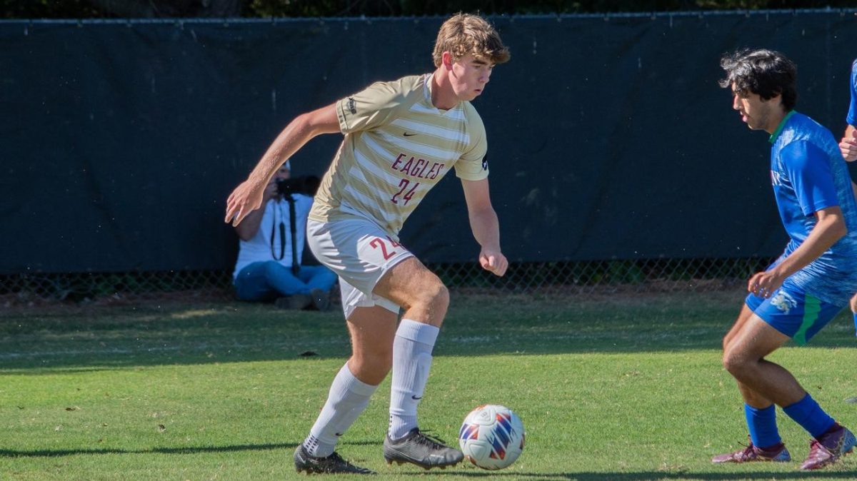 Freshman Trey Widrick engages a defender, showcasing his astute anticipation of his next move, all to spark opportunities for the Eagles. Widrick led all Eagle attackers with an impressive total of 24 shots attempted, 16 of which found the target, firmly establishing himself as the teams leading sharpshooter.