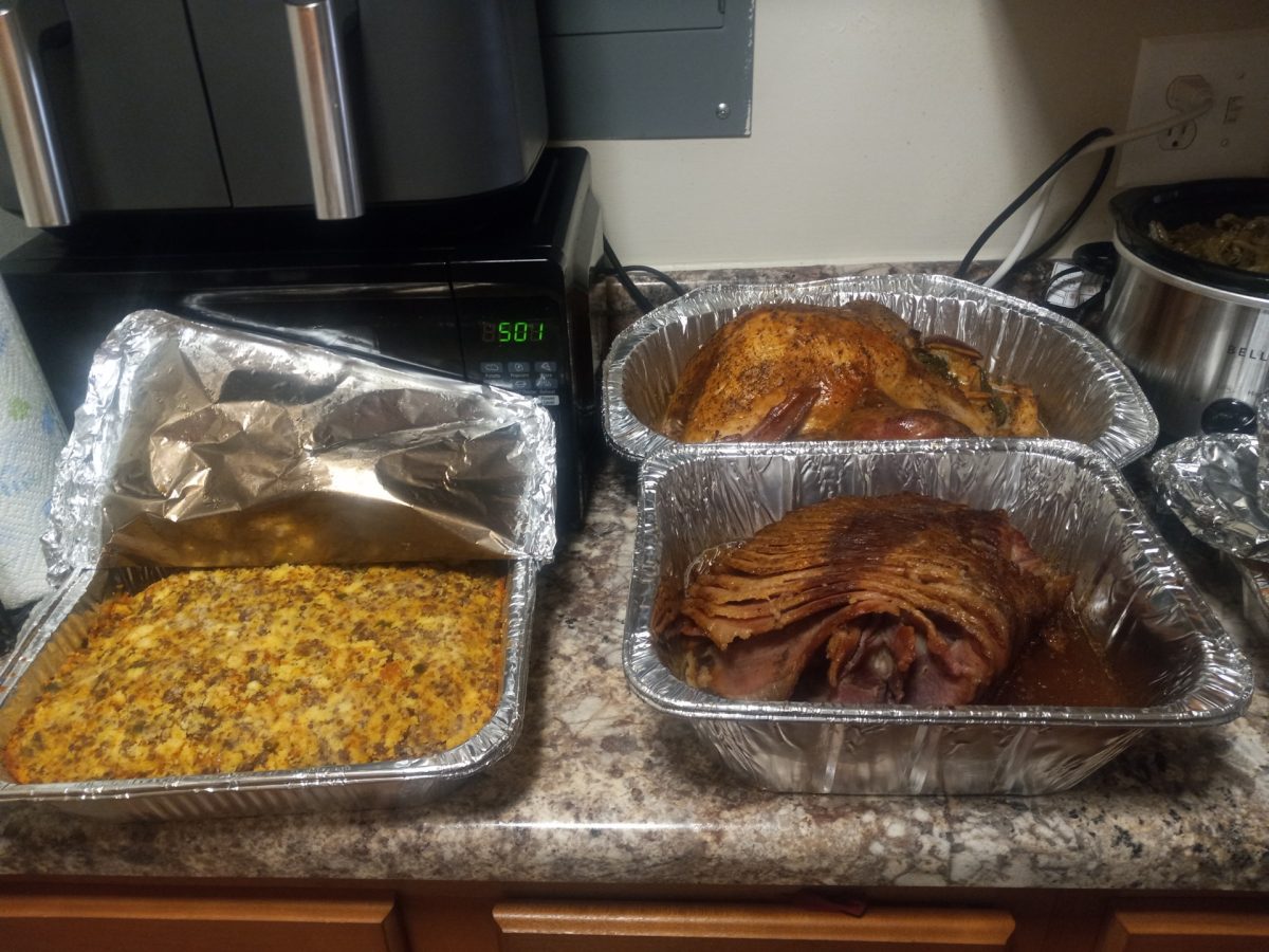 A Thanksgiving feast surrounded by other traditional foods like ham and macaroni and cheese. These foods are featured at many BC students Thanksgiving meals.