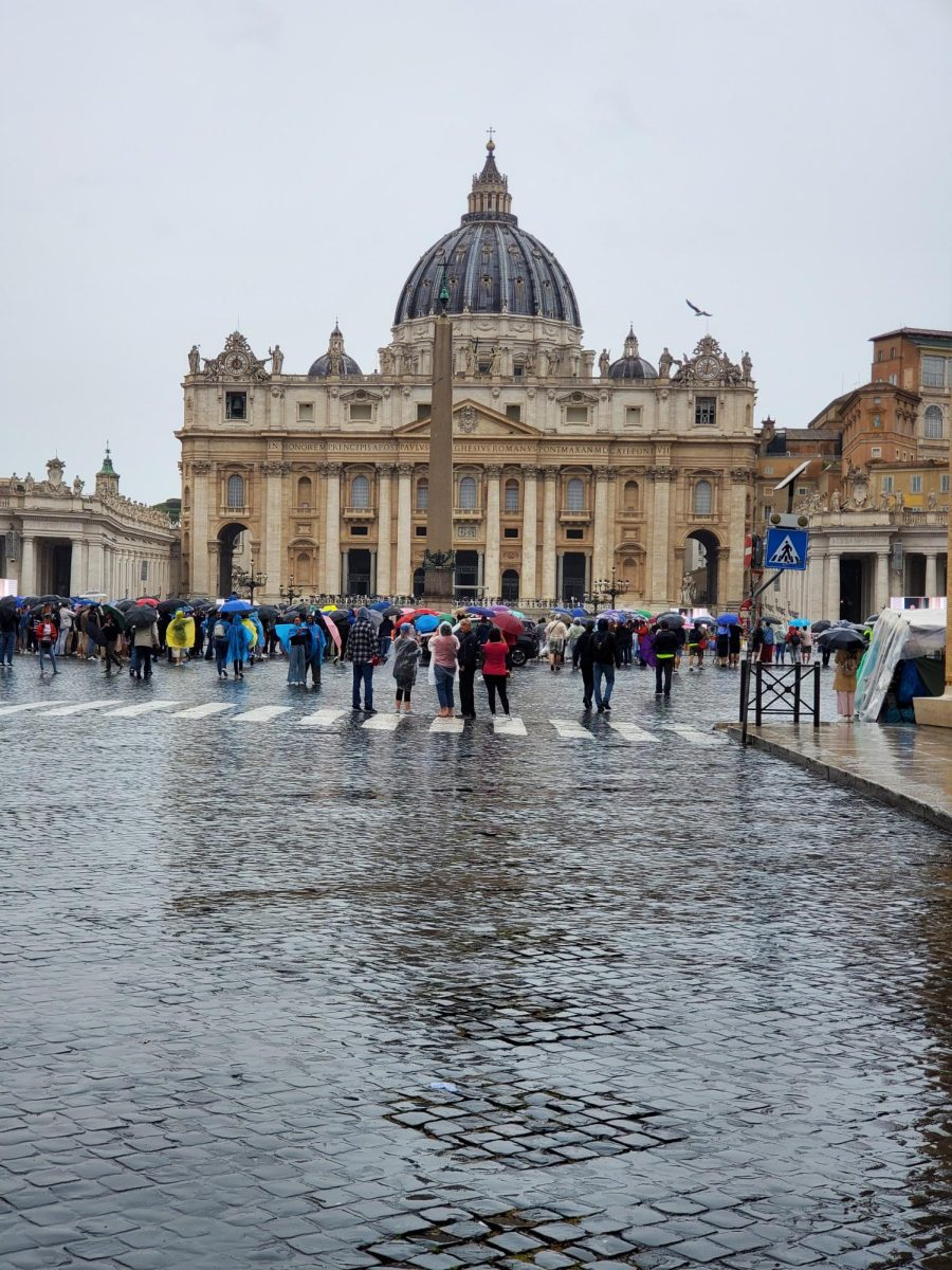 The entrance to Vatican City from Rome. In the center is the outside of the Basilica, where most of the Vatican Masses are held.