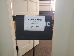 The entrance to Stone Chapel held the sign of where and when the Mass was being held. Catholic Campus Ministry, CCM, works closely with the James Madison University CCM, and hosts one Mass a semester in Stone Chapel every year.