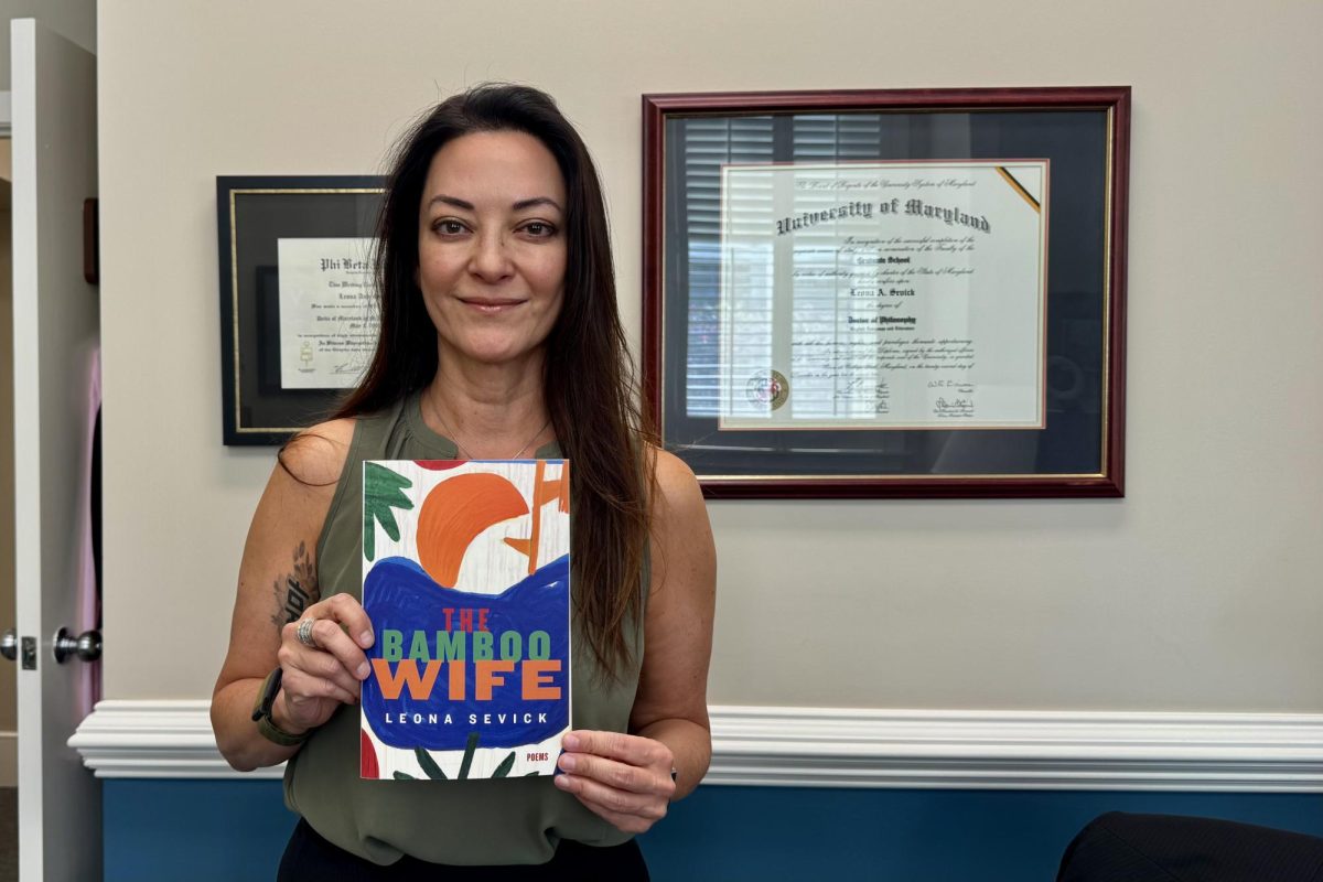 Dr. Leona Sevick poses with her new collection. Dr. Sevick is the Provost at Bridgewater College and Author of the poem collection, The Bamboo Wife. 