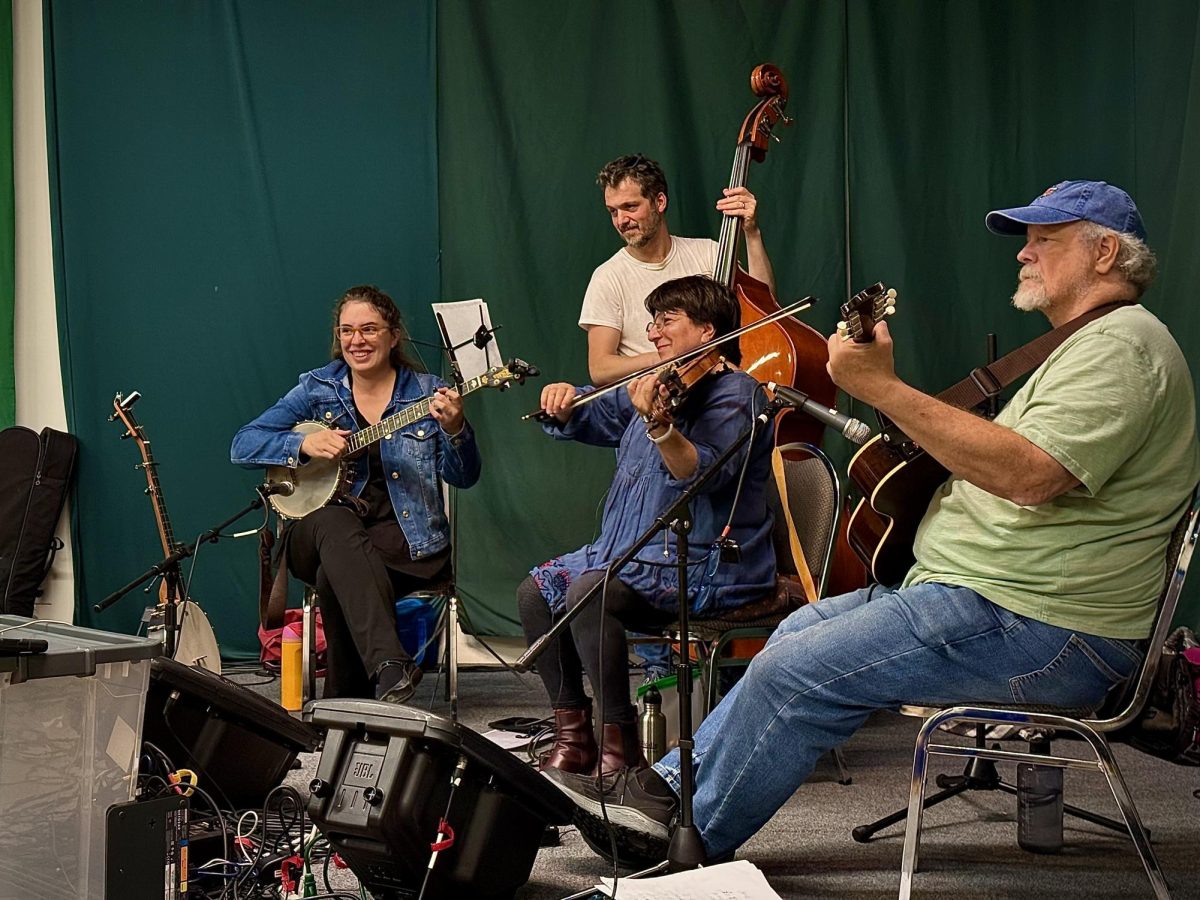 Janie and the Fine Tuners playing live folk music for the dancers. The community followed the rhythm of the music.
