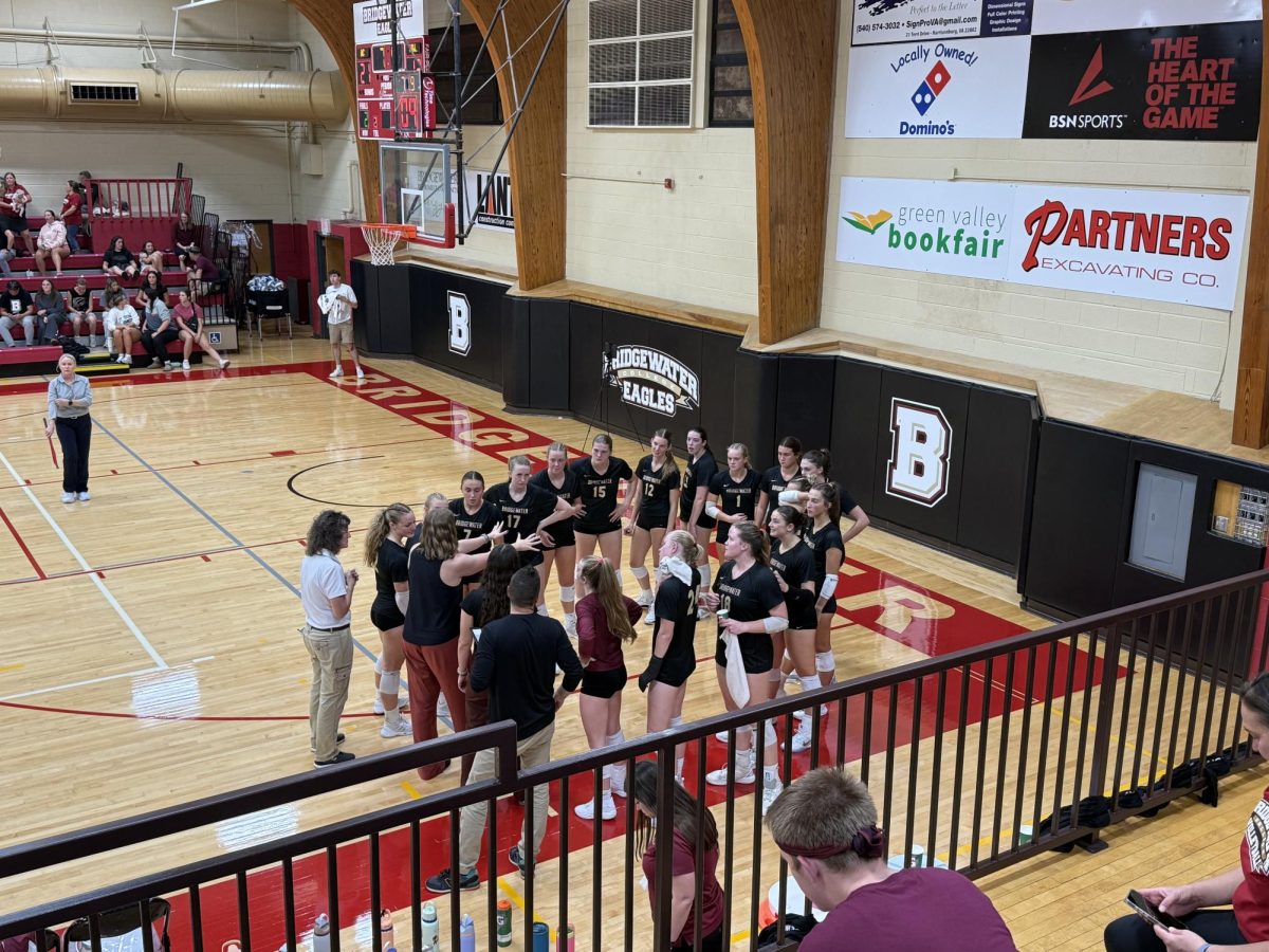 Head Coach Erin Harris talks about the importance of pressing on blocks during a time-out in the third set. Bridgewater was going point for point with Washington and Lee needed to gain an advantage.