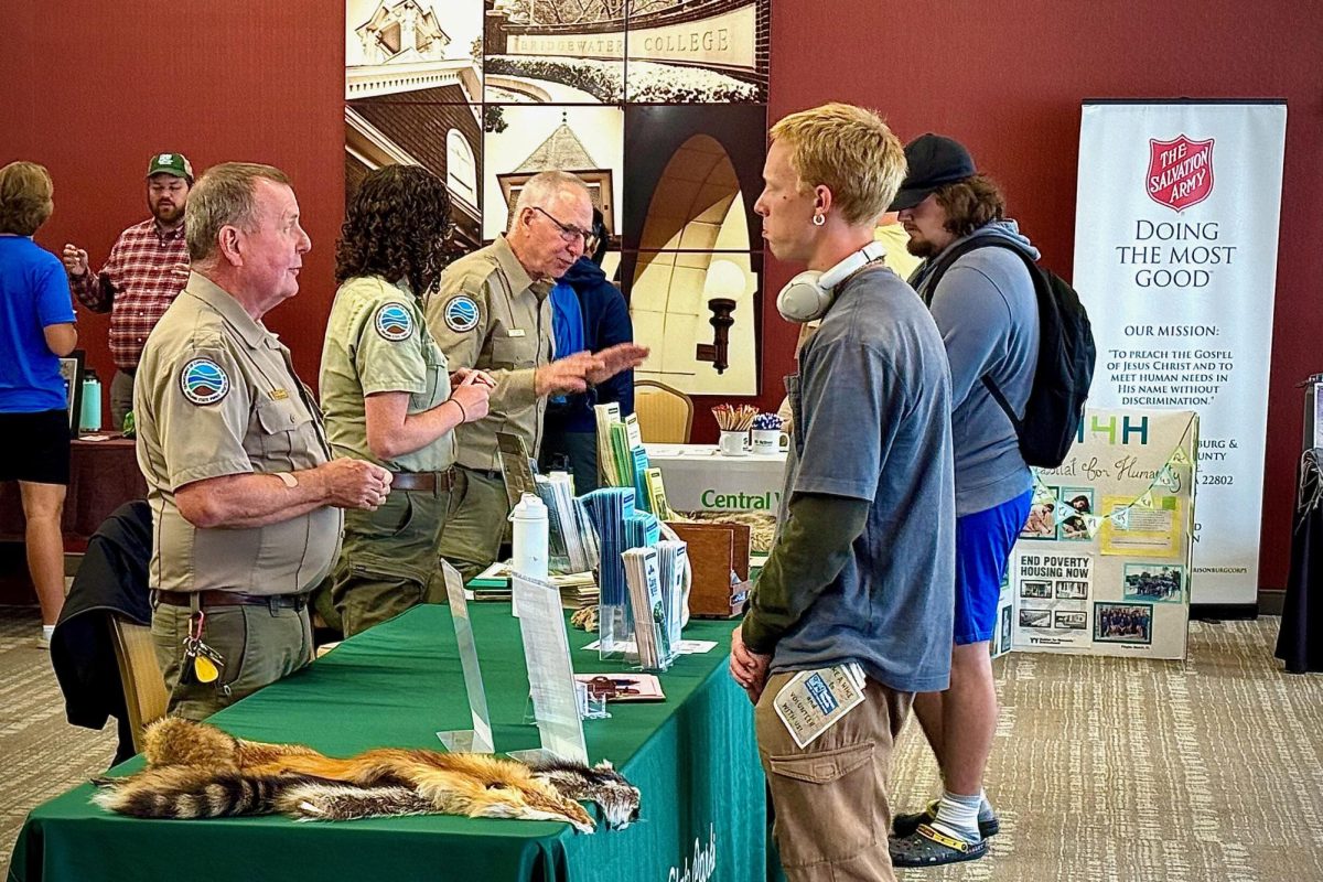 Bridgewater College students talk with representatives from the Virginia State Parks table. These representatives offer opportunities to get involved with their mission through volunteer service and environmental stewardship. 