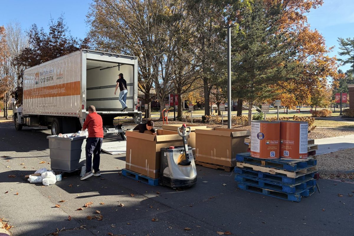 Students and faculty load donations into the Blue Ridge Area Food Bank’s truck. Athletes from several teams all came together to help pack everything up and send it off to be donated.