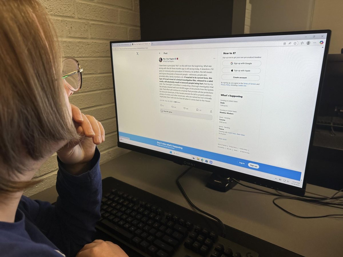 Bridgewater student Zoe Martin looks at Rep. Clay Higgins', R-La. tweet after voting “no” to release the Epstein files. 