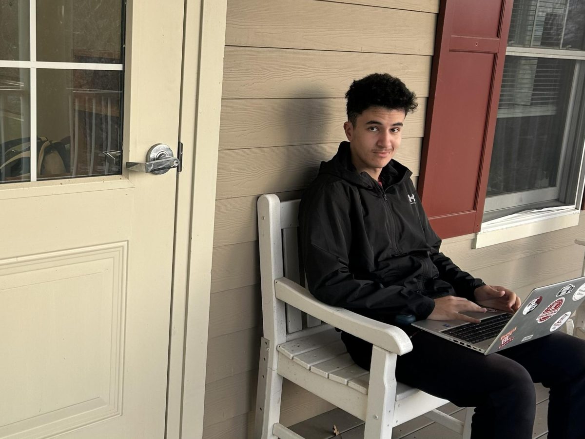 Bridgewater College junior Nasser Binoi looks out from his residence hall, reflecting on his journey from Morocco to life on campus.
