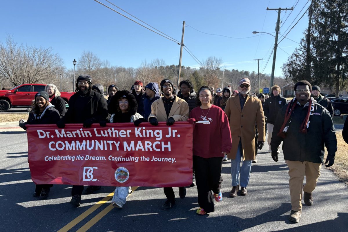 BC students hold a banner at the front of the community march for MLK Day. This is the first march since 2023.