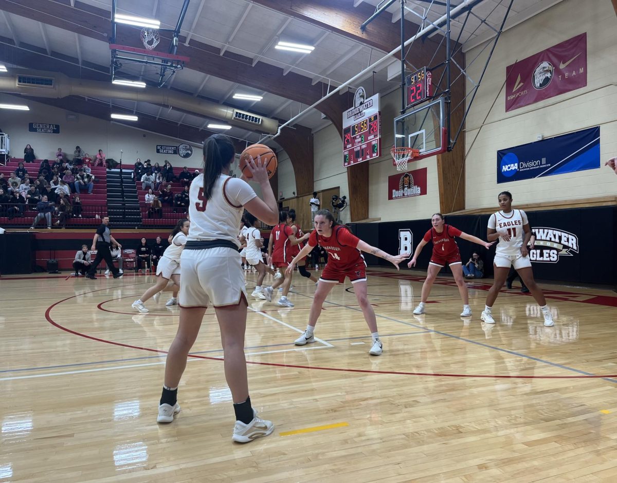 Senior Riley Corcoran in possession of the ball while her teammates look to get open. Corcoran is a notable player for the Eagles as a guard. 