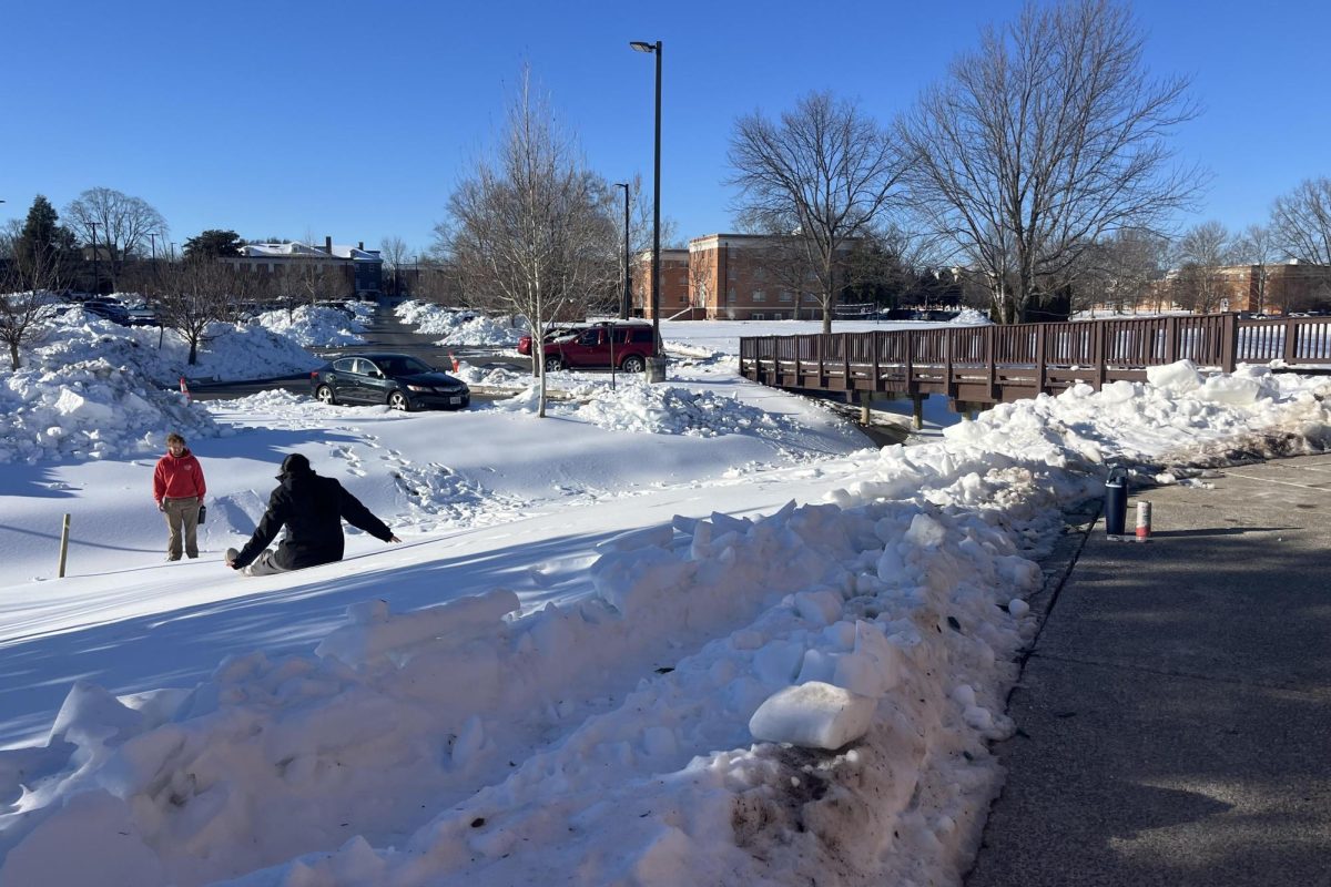 Bridgewater students Jayden Hendricks (left) and Makayla Harris (right) take turns watching each other slide down a hill outside of the Funkhouser Center. Snow and ice covered the area, leaving the ground fully frozen over and slick underfoot.