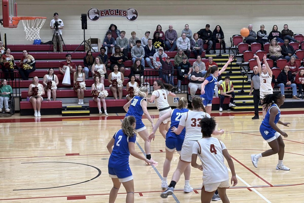 Aylin Humphreys shoots from the three-point line in the second half of the game. This was Humphreys’ first game back after injuring her foot in early January.