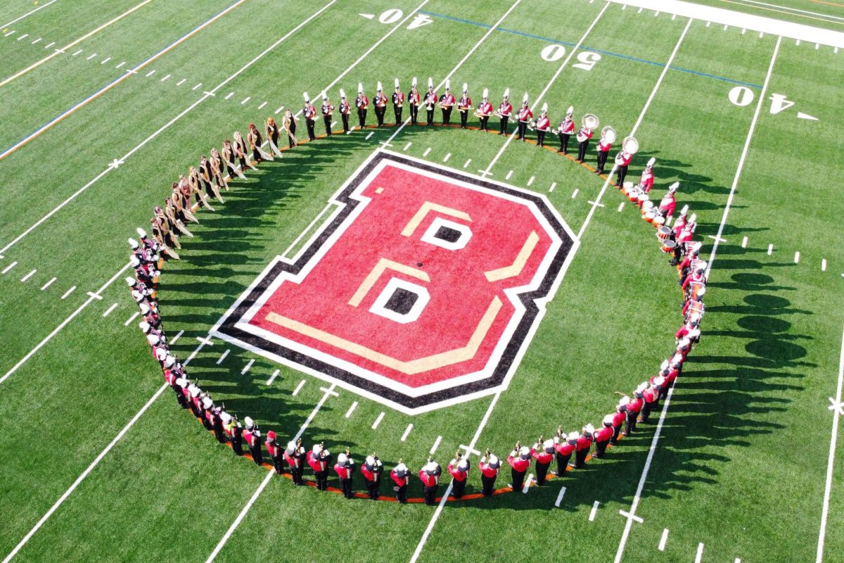 Bridgewater College Screaming Eagles Marching Band members posed in a circle. The Screaming Eagles season ended with a second place win in a Metallica competition. Image courtesy of Stephen Layton.
