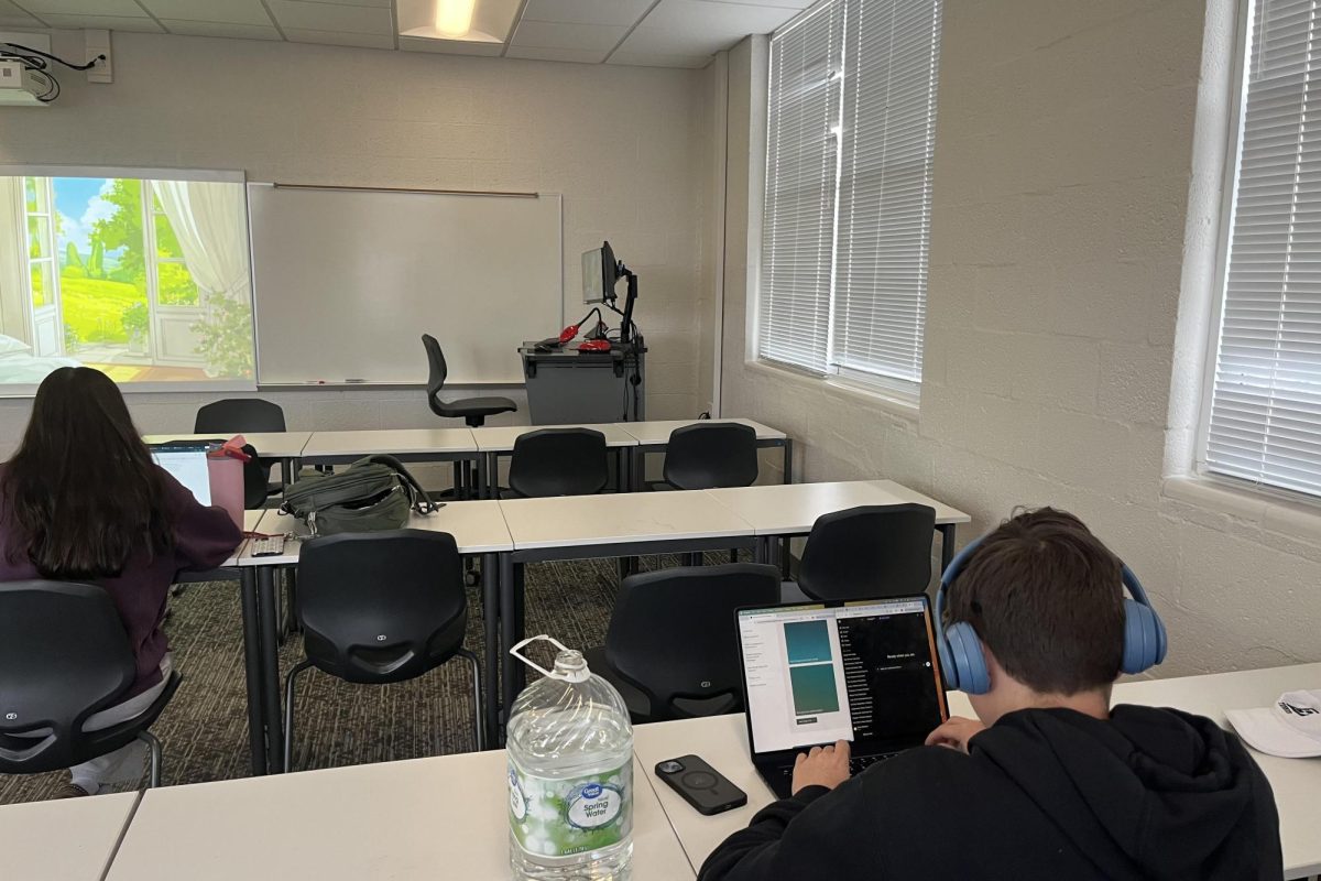 Macy Harris (left) and Corey Beshoar (right) work on laptops during their studying session. Beshoar uses artificial intelligence to help organize research and clarify course materials, reflecting how A.I. tools are increasingly integrated into student learning.