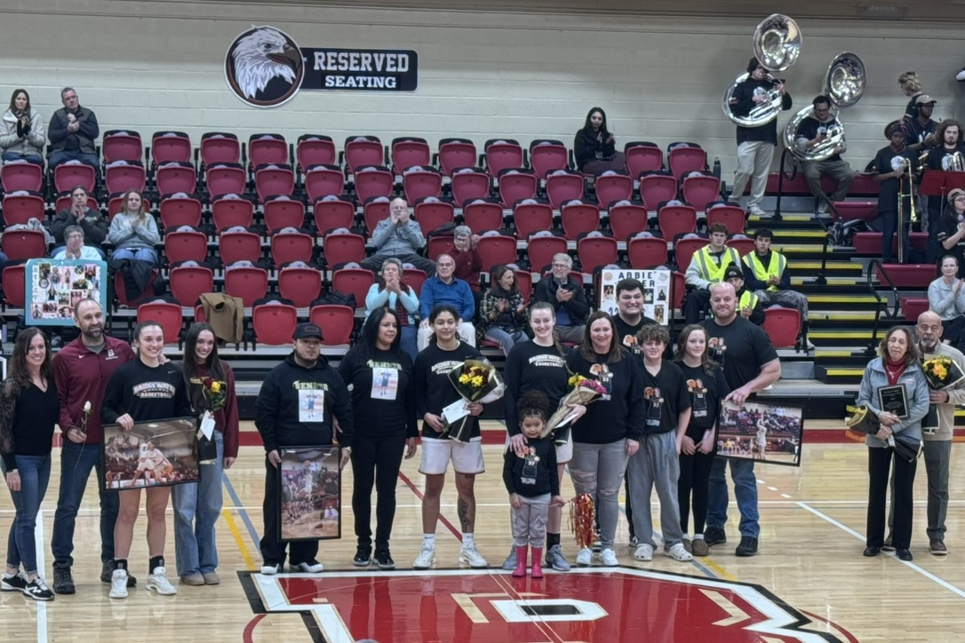 Bridgewater women's basketball seniors with their families at the senior night celebration. This group of BC Eagles includes 2 starters for the team.