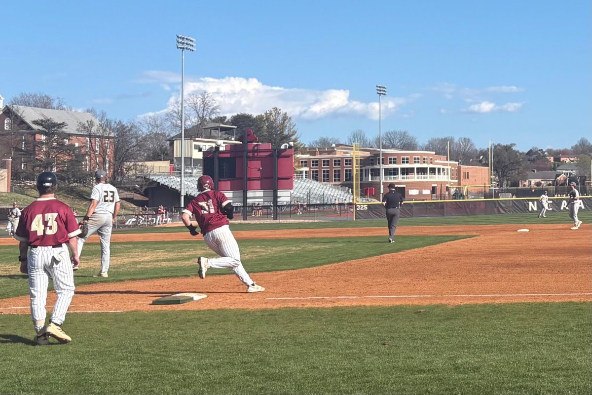 Junior catcher Jake Harris advances to first base after hitting a single to left field. This hit allowed senior outfielder Bryce Suters to advance to third and then later home plate, giving the Eagles an 8-1 lead