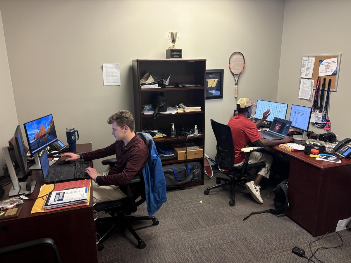 Associate Director of Athletic Media Relations Lucas Van Deventer, left, and Assistant Director of Athletic Media Relations Josh Smith work in the Bridgewater athletic media relations office. The department uses writing, digital content and other forms of storytelling to connect with audiences and tell the stories of Bridgewater athletes.