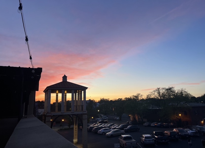 Sunset view from the rooftop of Capital Ale House, a popular spot where students love to eat and hang out. The warm colors and city skyline make it a favorite place to unwind at the end of the day.